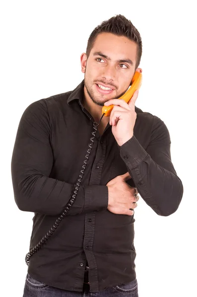 Closeup portrait of handsome hispanic man talking on corded retro phone — Stock Photo, Image