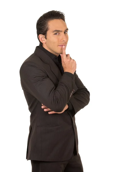 Handsome young man wearing a suit posing gesturing silence — Stock Photo, Image