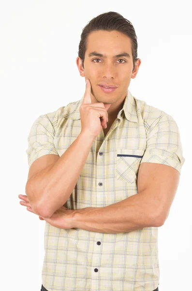 Young handsome hispanic man posing with hand on chin — Stock Photo, Image