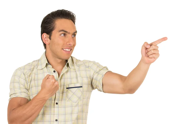 Handsome young casual man posing pointing to the side — Stock Photo, Image