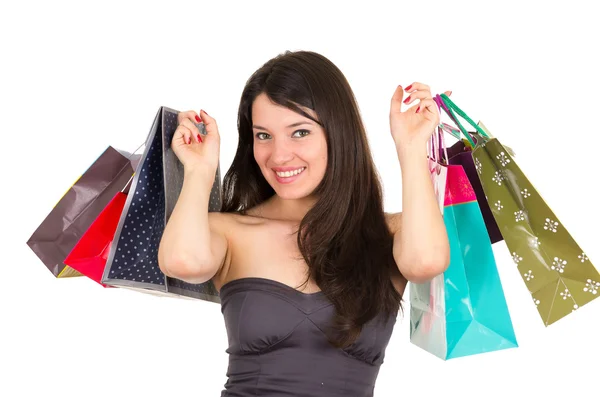 Bella giovane bruna sorridente donna shopping holding bags — Foto Stock