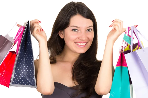 Bela jovem morena sorrindo mulher compras segurando sacos — Fotografia de Stock