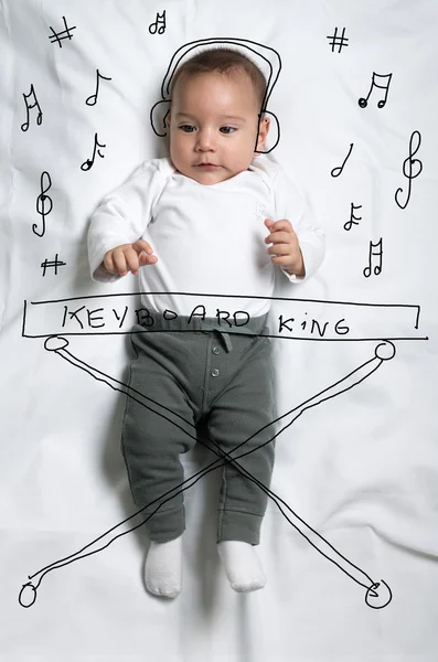 Cute baby boy decorated as a pianist — Stock Photo, Image