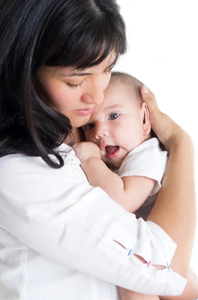 Loving mother holding baby close to her chest — Stock Photo, Image