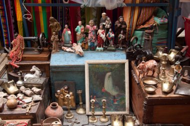 Colorful antique stall with in the popular Otavalo market, Ecuador clipart