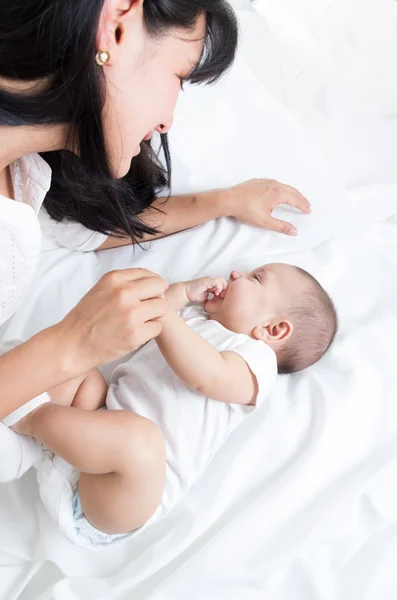 Loving mother looking at her adorable baby boy — Stock Photo, Image