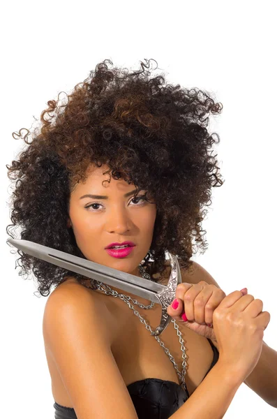 Beautiful exotic young tribal woman holding a dagger — Stock Photo, Image