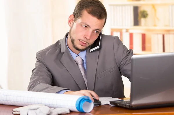 Young handsome architect working in an office — Stock Photo, Image