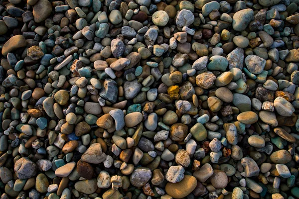 Primer plano de arena playa rocas — Foto de Stock