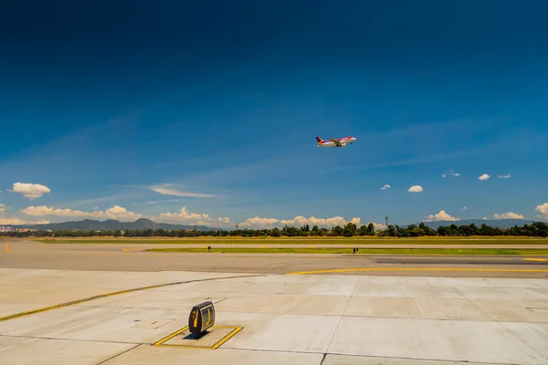Departure flight Avianca airplane cruising the sky at El Dorado airport in Bogota Colombia — Stock Photo, Image