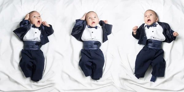 Set of poses, cute worried baby boy wearing an elegant suit with bow tie — Stock Photo, Image