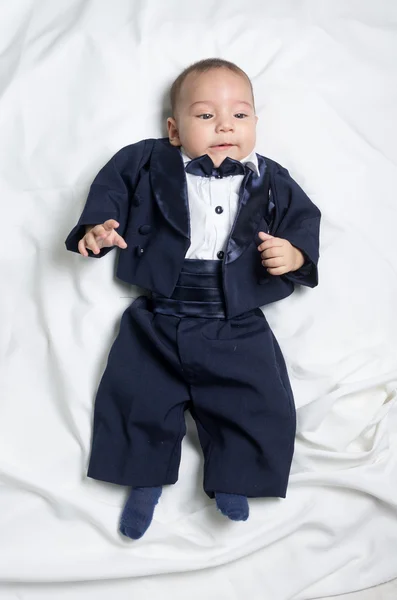 Cute baby boy wearing an elegant suit with bow tie — Stock Photo, Image