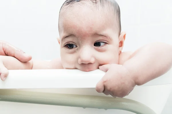 Close up of baby boy face during bath — Stock Photo, Image