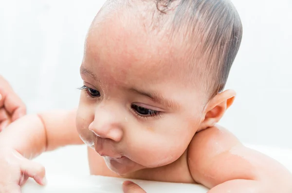 Close up of baby boy face during bath — Stock Photo, Image