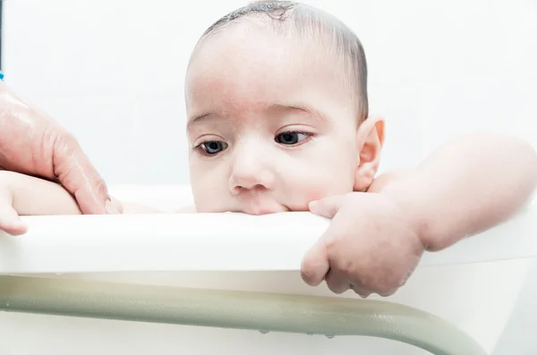 Close up of baby boy face during bath — Stock Photo, Image