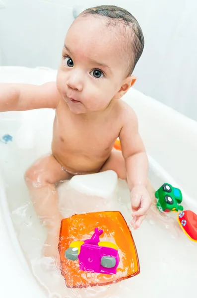 Baby boy playing with toys in the bathtub — Stock Photo, Image