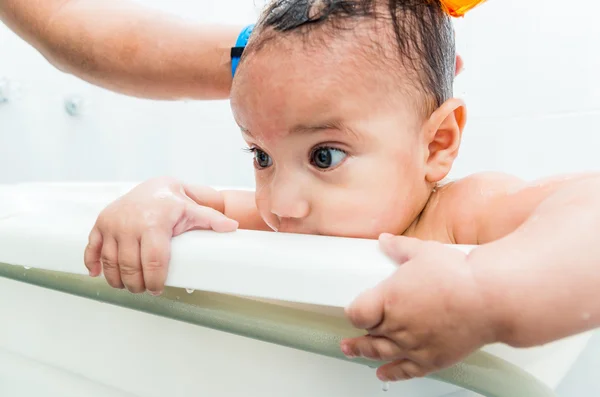 Close up of baby boy face during bath — Stock Photo, Image