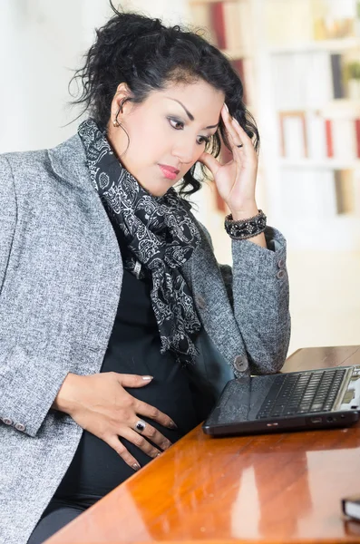 Pregnant hispanic woman wearing casual clothes at work — Stock Photo, Image