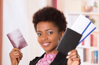 Black office woman tickets and passport
