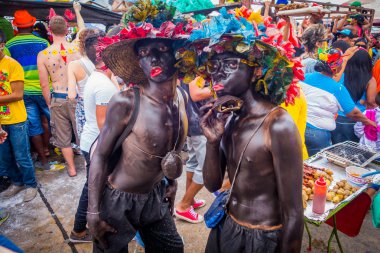 Performers dressed as El Africano with colorful and elaborate costumes dancers that represent african colombian characters participate in Colombias most important folklore celebration, the Carnival