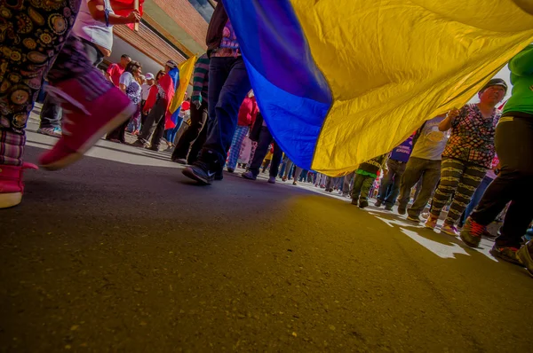 Street view from under giant ecuadorian flag during anti government march and protests in Quito — Stok fotoğraf