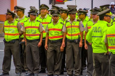 Policeman waiting for Pope Francis Popemobile motorcade comming as his first oficial visit to Quito, Ecuador