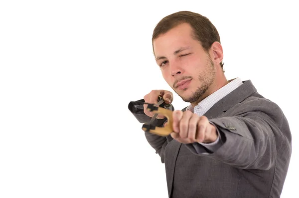 Hansome buisness man concentrated aiming a slingshot isolated over white background — Stock Photo, Image