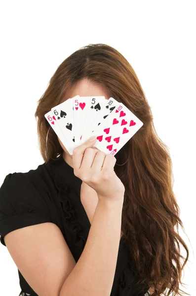 Mooie brunette jonge meisje houden dek van kaarten — Stockfoto