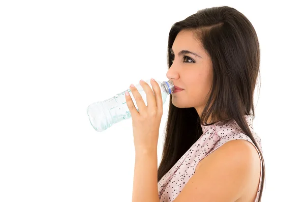 Beautiful young girl drinking water from a plastic bottle — Stock Photo, Image