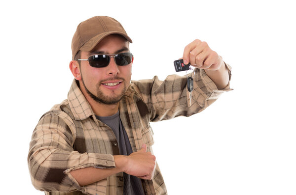 happy young guy in flannel shirt and cap showing car keys