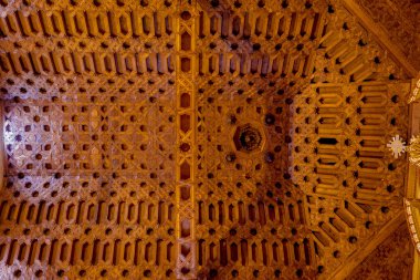 Caption of spectacular wooden roof inside San Diego church with extremely detailed decorated carvings