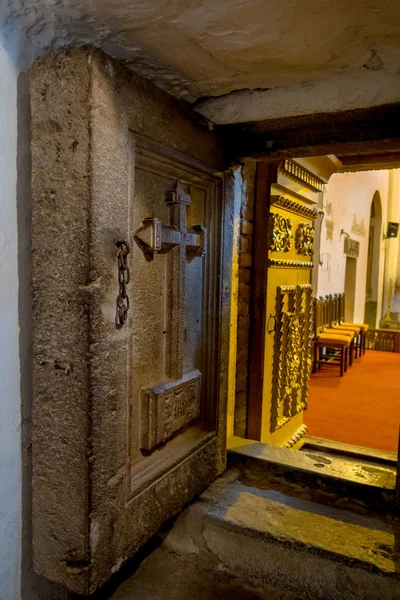 Massive stone door with cross on it inside the historical church of San Diego — Stock Photo, Image