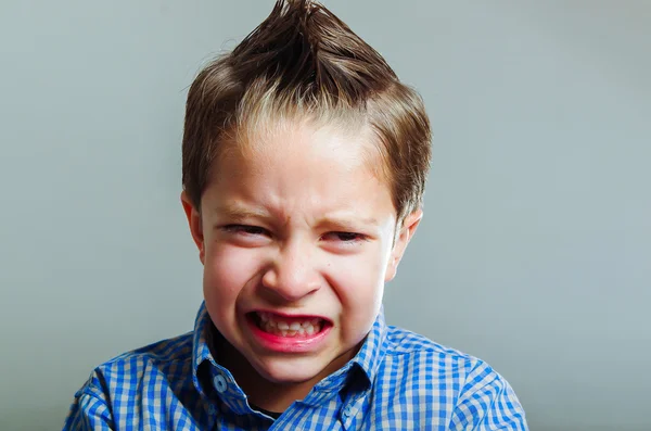 Sweet little boy gesturing anger — Stock Photo, Image