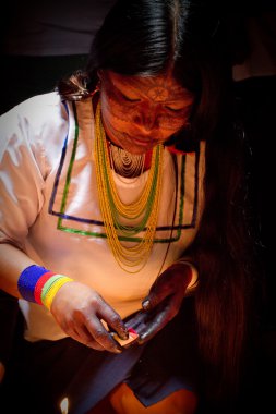 Unknown indigenous woman during a ritual in the amazon rainforest clipart