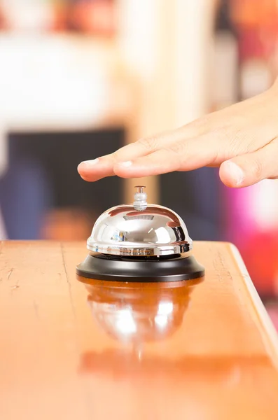 Hotel bell at reception desk — Stock Photo, Image