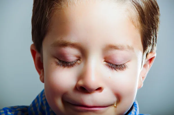 Sweet little boy gesturing sadness — Stock Photo, Image