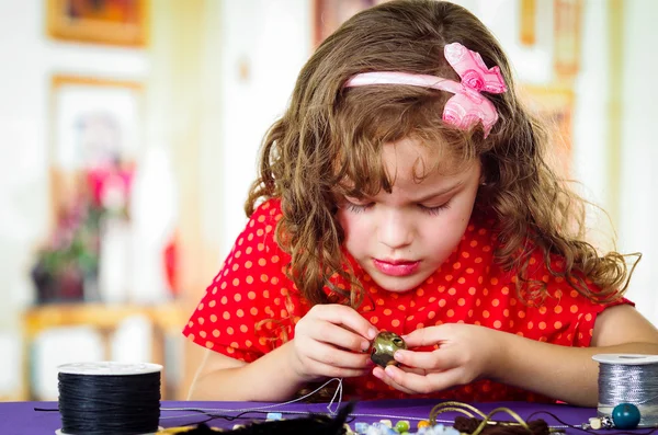 Adorable little girl making crafts — Stock Photo, Image