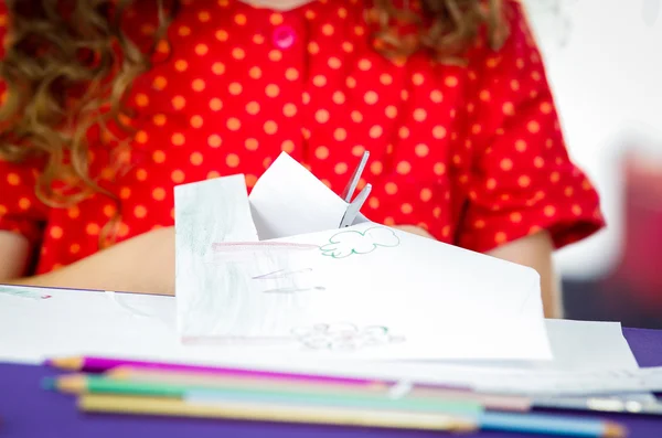 Little girls hands using scissors — Stock Photo, Image