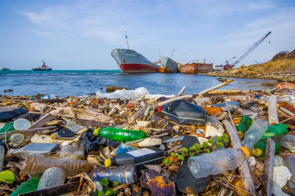 COLON, PANAMA - APRIL 15, 2015: Waste and pollution washing on the shores of the beach in city of Colon in Panama