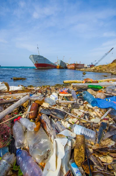 COLON, PANAMA - APRIL 15, 2015: Waste and pollution washing on the shores of the beach in city of Colon in Panama