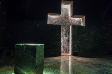 Marble sculpture cross at underground Salt Cathedral Zipaquira built within the multicolored tunnels from a mine. One impresive accomplishment of Colombian architecture.