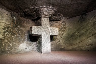 Marble sculpture cross at underground Salt Cathedral Zipaquira built within the multicolored tunnels from a mine. One impresive accomplishment of Colombian architecture.