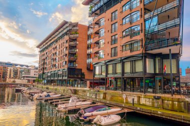 OSLO, NORWAY - 8 JULY, 2015: Charming modern rustic architectural apartment and office buildings waterfront at Aker Brygge during sunset hour