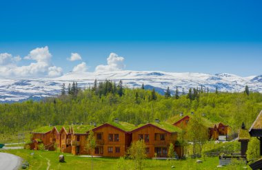 VALDRES, NORWAY - 6 JULY, 2015: Traditional Norwegian mountain cabins of wood with grassy rooftops sorrounded by stunning nature