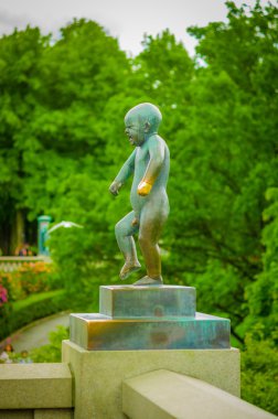 OSLO, NORWAY - 8 JULY, 2015: The most famous sculpture of Vigelandsparken called Sinnataggen in all its glory on a beautiful summer day clipart