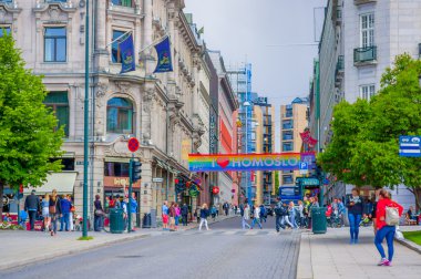 OSLO, NORWAY - 8 JULY, 2015: Beautiful architecture concrete buildings in Rosenkrantz gate with a pro homosexual banner stretching across