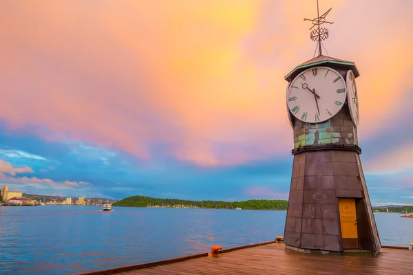 OSLO, NORWAY - 8 JULY, 2015: Charming small clocktower located at Aker Brygge pier during sunset hour — Stok fotoğraf