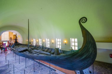 OSLO, NORWAY - 8 JULY, 2015: Beautiful preservation of Osebergskipet as presented in the viking museum at Bygdoy, shot from slightly above angle