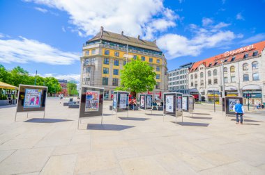 OSLO, NORWAY - 8 JULY, 2015: Plaza in front of Oslo Central station with people around on nice sunny day