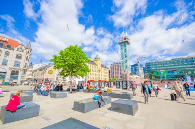 OSLO, NORWAY - 8 JULY, 2015: Plaza in front of Oslo Central station with people around on nice sunny day